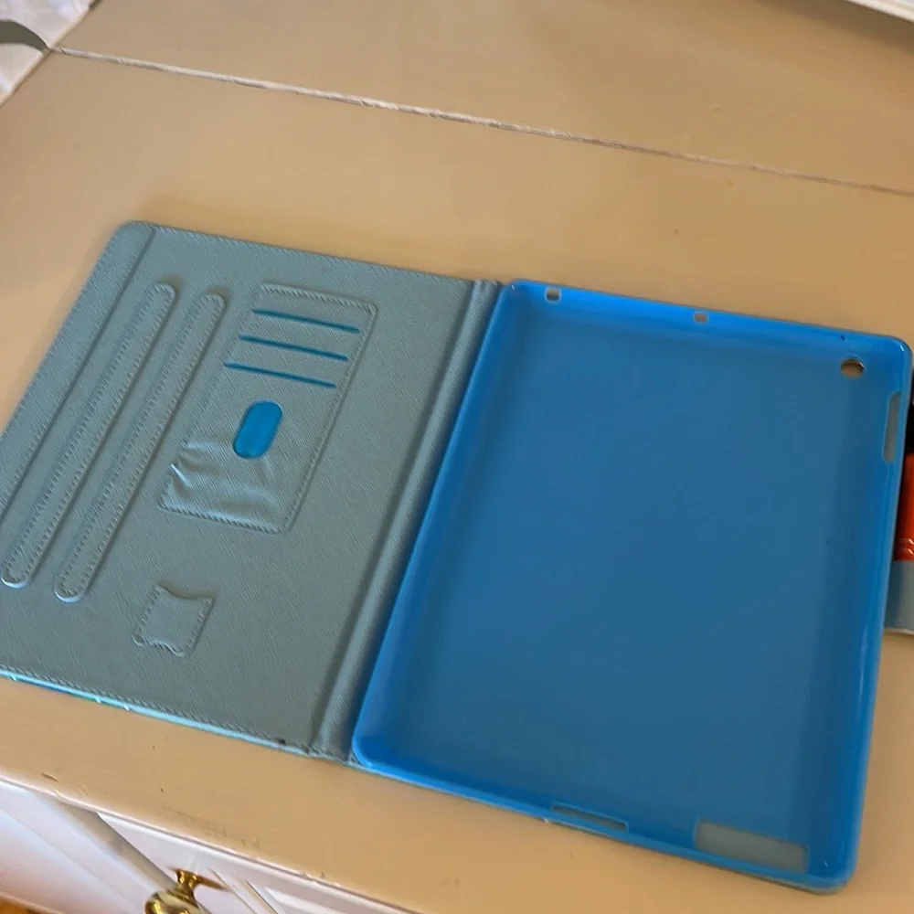 iPad cover 7 1/2” wide x 10” never used.